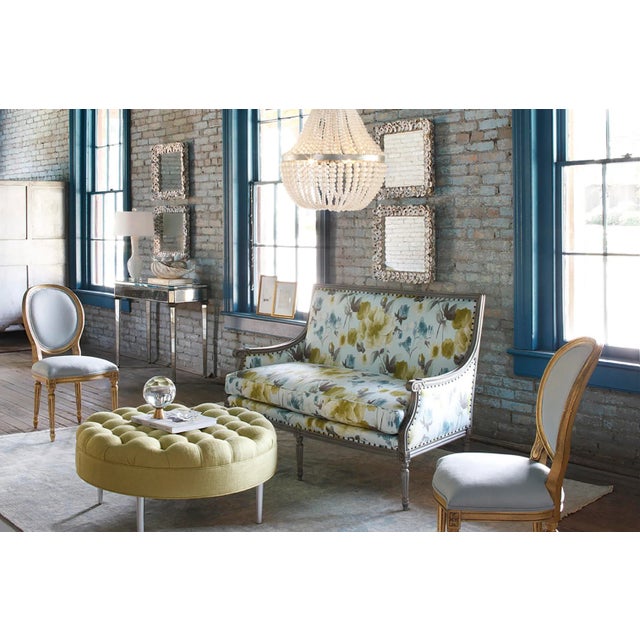 Fitted cleverly along the frame of the Oyster Shell Mirror are half shells with rounded edges that provide this decorative...