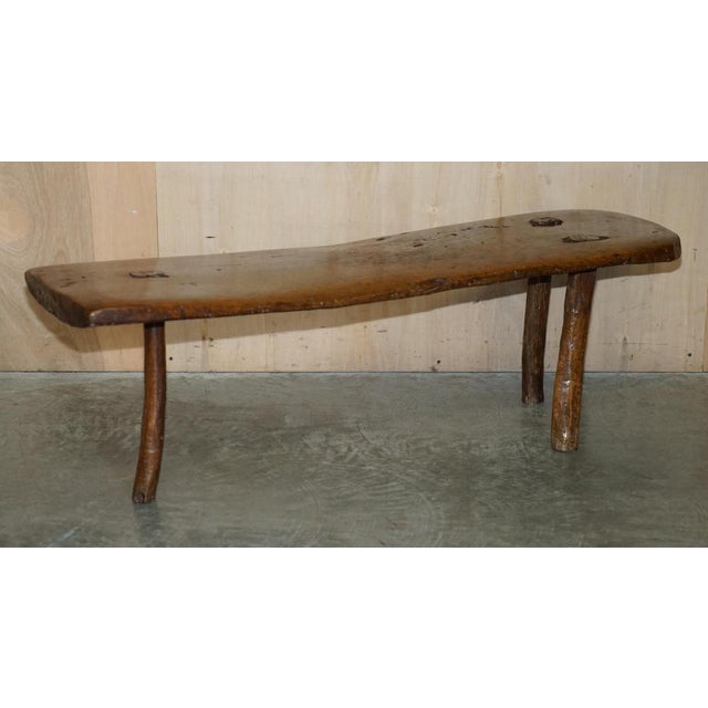 Stunning, super rare 18th century spanish primitive three legged bench which can be used as a coffee table. This has to be...