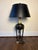 Striking vintage Neoclassical table lamp distinguished by unusually elaborate sculptural metalwork and architectural...