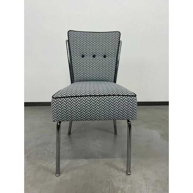 Mid-century modern tubular steel chair by Jozsef Peresztegi, with new fabric.