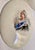 This is a sweet depiction of the lovely Queen Victoria with her fantastic jewelry and adornments, on a convex porcelain...