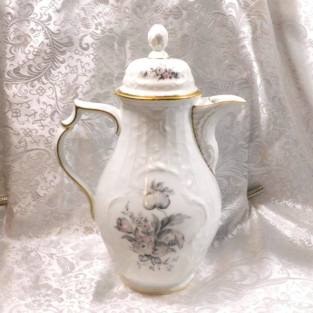 This is a Rosenthal Coffee Pot in the Grey Rose pattern from 1971. The pot is white with a woven design, gray and pink...