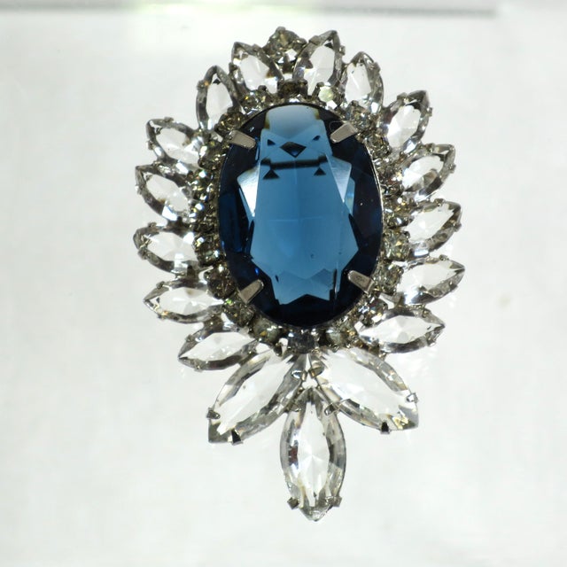 Vintage designer DeLizza & Elster Juliana rhodium-plated sapphire crystal brooch and clip-back earrings set. The brooch is...