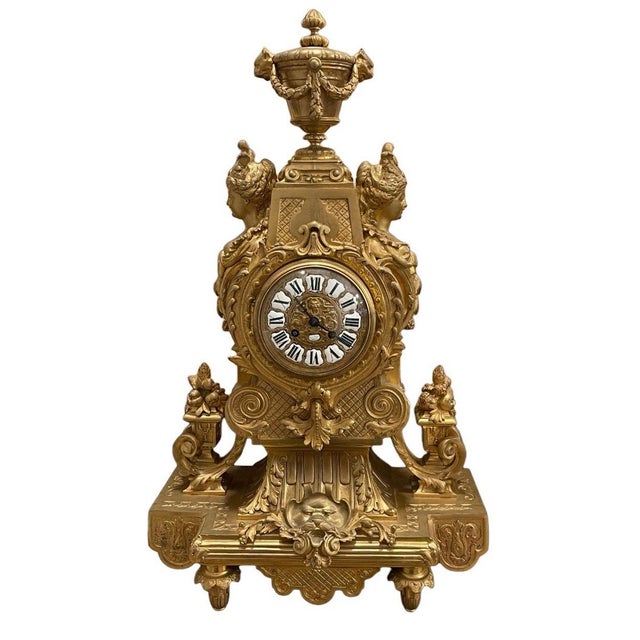 An exceptional and monumental late 19th century French doré bronze clock garniture, consisting of a richly sculpted mantel...