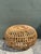 This iconic vintage Italian ottoman is a masterclass in Mid-Century Organic Modernism, meticulously designed in the...