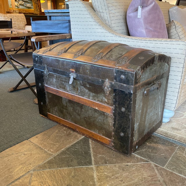 Design Plus Gallery presents an Antique Steamer Trunk. Quite an innovation, this metal clad/wood strapped curved top not...