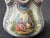 Vintage Royal Rudolstadt hand painted bisque basket with double handle. A Renaissance couple on one side, a flower bouquet...