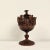 A German or Swiss carving of an urn with grapes, 19th century. From a tradition of making carvings in winter for sale in...