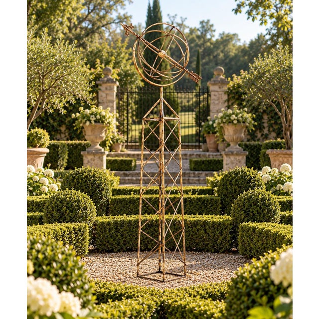 A beautifully crafted iron armillary sphere on stand, evoking the timeless elegance of classical European gardens. Pieces...