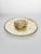 A 20th-century decorative set comprising a large circular platter and a matching small trinket dish. Both pieces feature a...