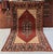 Persian Senneh design hand-knotted rug featuring a large rust diamond medallion filled with dense herati lattice and a...