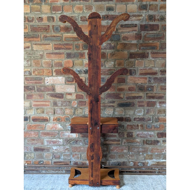 An exceptional late-Victorian / Edwardian solid oak hall stand, circa 1890–1920. This functional statement piece combines...
