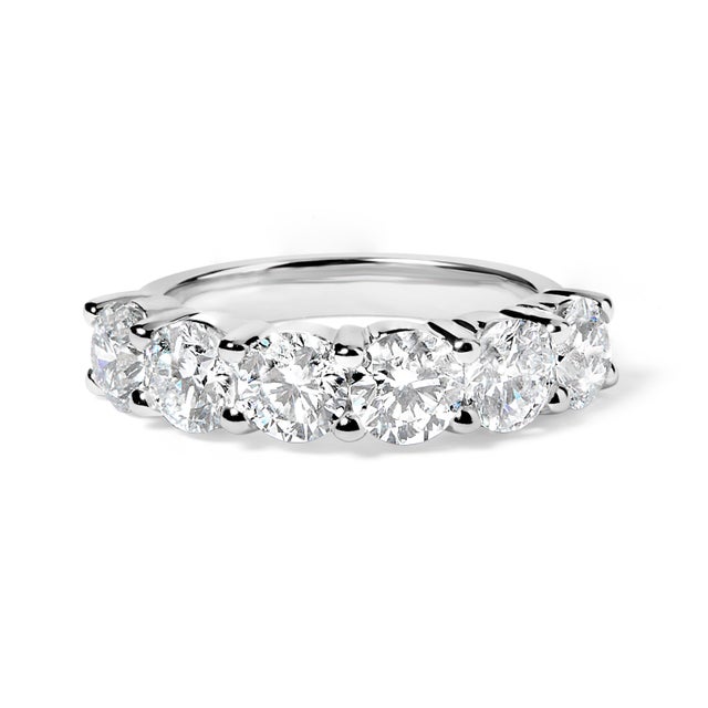 Celebrate love's eternal dance with this exquisite ring, a fusion of tradition and innovation. Six dazzling lab-grown...
