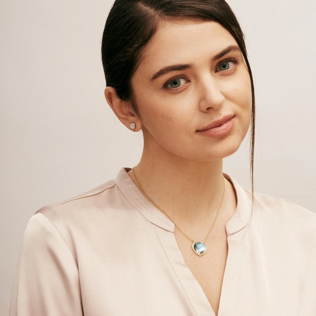 Created in 18 karat yellow gold Blue topaz 16 carats approx. Diamonds 0.20 carat approx. 18 inch necklace with loops at...