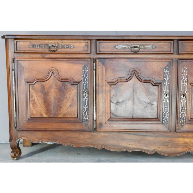 From the 19th century, this gorgeous piece is sure to make a statement. At 8.5' long, it has four doors across the front,...