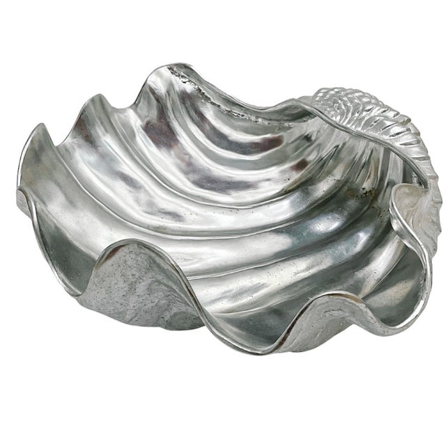 A glamorous 1980s oversized tabletop aluminum clam shell bowl made by Arthur Court. Beautiful textural finish on the...