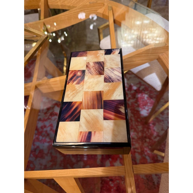 Refined Italian decorative box from the 1970s, featuring a striking inlaid top composed of alternating geometric panels in...