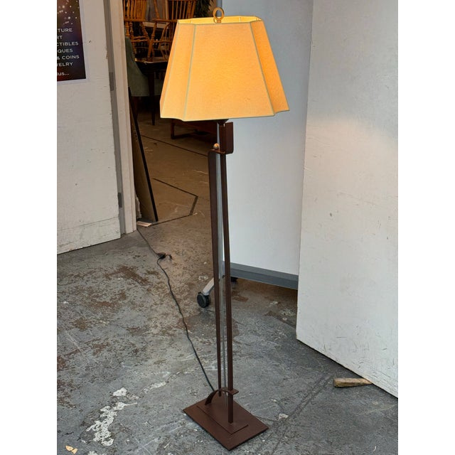 Design Plus Gallery presents a Vintage Floor Lamp from Hubbardton Forge. This piece showcases a linear metal framework...