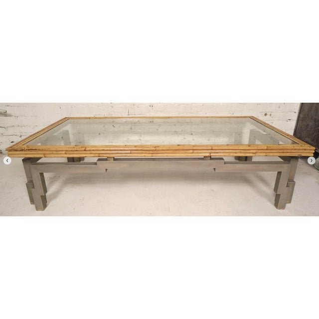 Unique long coffee table with metal frame and bamboo trim. Metal frame has a great shape and the yellowish trim gives a...