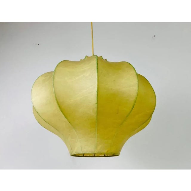 A cocoon pendant lamp made in italy in the 1960s. The hanging lamp has been manufactured in the design of the lamps made...