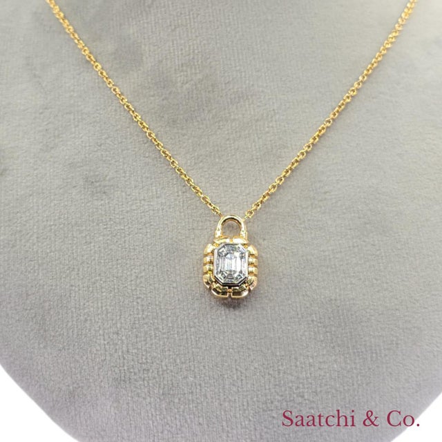 Illusion Lock Shape Diamond Pendant Metal Type: 18K (750) Yellow Gold Total Item Weight: 7.65 Grams Length: 15 – 16.5 Inch...