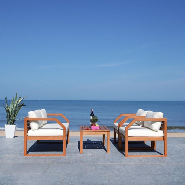 Create an instant outdoor living room with this contemporary 4 piece living set. Warm and inviting, it features a sleek...