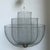 Designed by Rick Tegelaar for Moooi, the "Meshmatics" chandelier is a triumph of industrial artistry and ethereal...