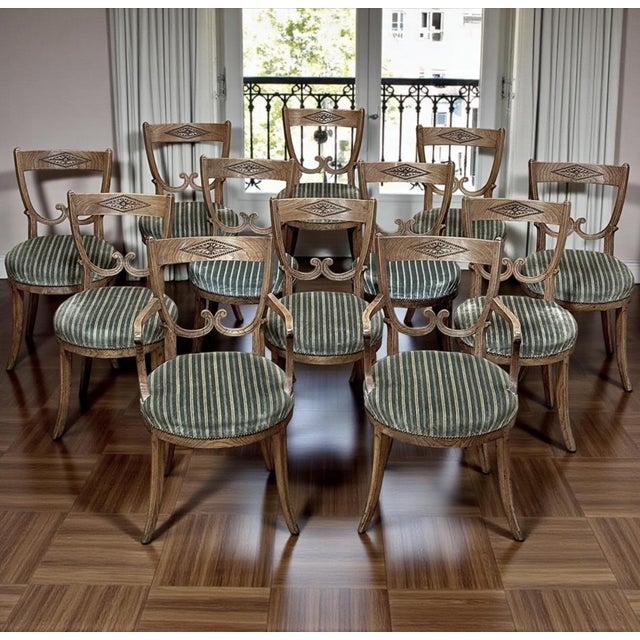 Set of Twelve 18th Century Swedish Gustavian Dining Chairs includes 2 Armchairs were built to grace an elegant mansion in...