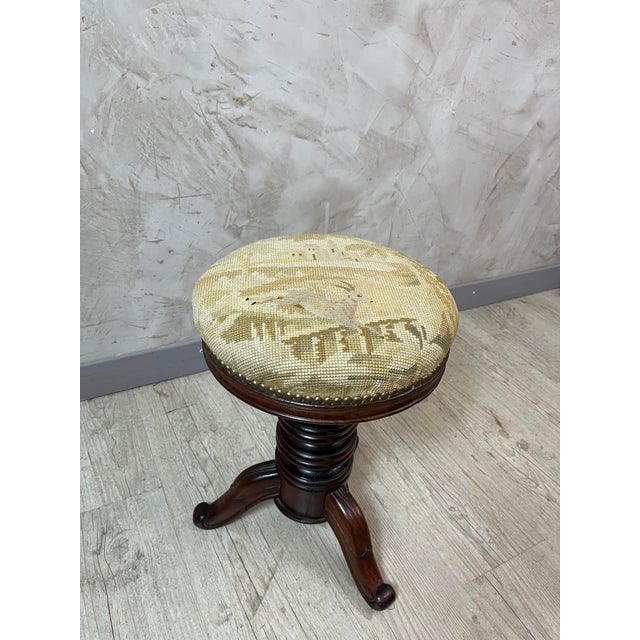 Add style to your home with this beautiful, authentic 1900 walnut piano stool. Features: – Height adjustable by central...