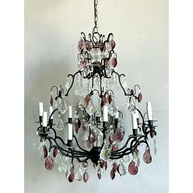 This stunning vintage chandelier epitomizes the dramatic elegance of the Hollywood Regency era, blending classic form with...