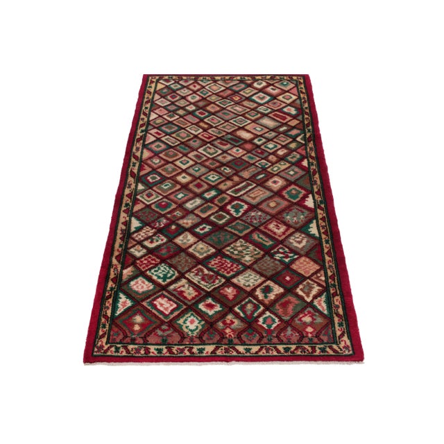 Hand-knotted in wool from Turkey circa 1950-1960, a 4x7 vintage rug from a bold multidisciplinary Turkish designer...