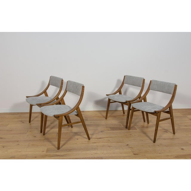 This set of four dining chairs was produced by Zamojska Furniture Factory in Poland circa 1970. It was designed by Juliusz...