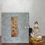 This exquisite vintage statue depicts a seated Guanyin (Bodhisattva) resting upon a golden lotus base. Crafted from...