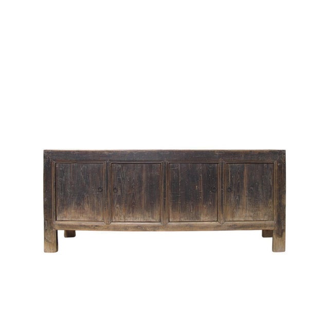 This vintage sideboard is made from reclaimed solid wood featuring a weathered, dark charcoal brown finish with rustic...