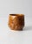 This vintage studio pottery bowl features a warm caramel glaze and a softly rounded form with a small, gently shaped...