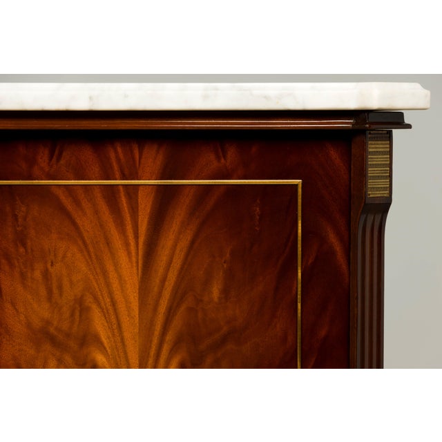 Sourced in Provence, France, this French Louis XVI style sideboard buffet is crafted from richly figured mahogany and...