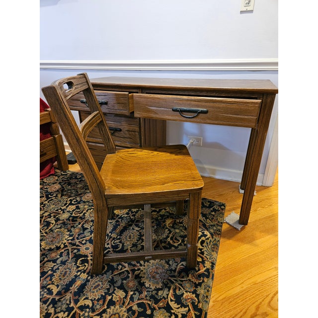 Ranch oak desk, solid wood construction Includes 1 matching chair Estimated chair dimensions: 31" H, 16" W, 16" deep, and...