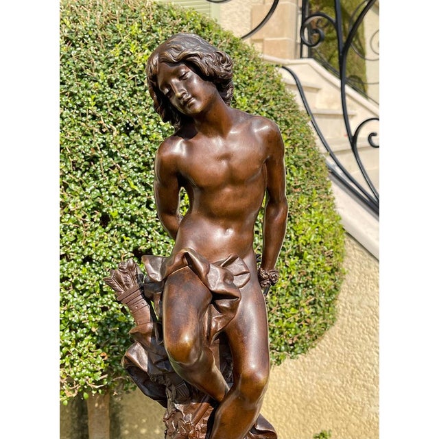 Bronze sculpture with brown patina representing "Cupid" signed on the base "Henri PLÉ". The patina is beautiful and...