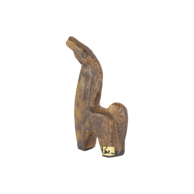 A ceramic horse designed by the German ceramicist Helmut Friedrich Schäffenacker (1921-2010). This abstracted, brown horse...