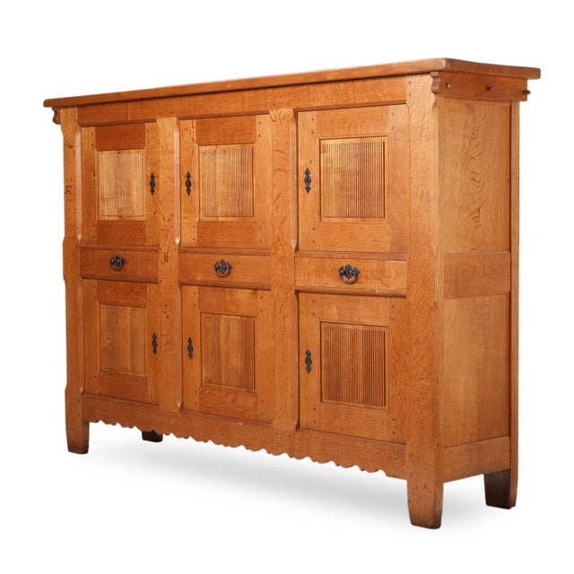 Henry KjareUnique oak cabinet, front with six doors with carvings and visible joints, behind which shelves and trays. H....