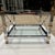 Chrome and brass end table with tiered glass inset having x-stretcher side members each corner ending in ball finial's...