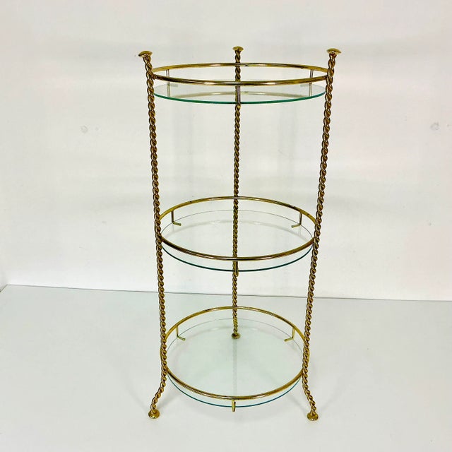 This is a lovely 3-Tier Glass and Metal round plant stand from the 1970s. The design is Hollywood Regency Boho Chic with...