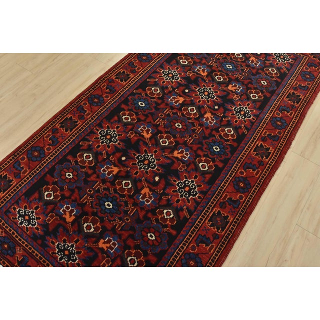 An authentic vintage traditional tribal Luri rug hand-knotted with fine wool and natural dyes. This oriental rug features...