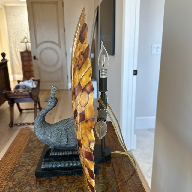 This is distinctive Art-Deco inspired lamp by Maitland Smith, featuring a sculptured peacock. The lamps focal point is a...