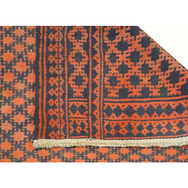 A fantastic vintage Persian cotton Kilim rug with a wonderful all-over stylized flower pattern woven in red and indigo...