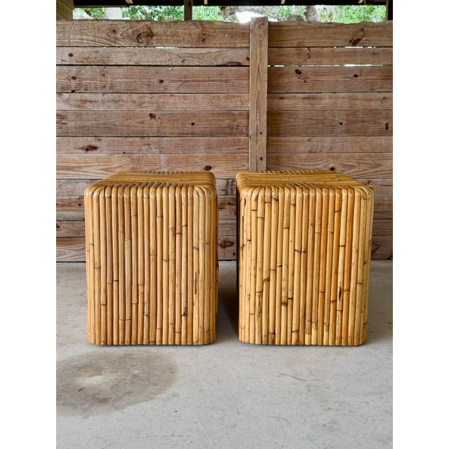 Exceptional pair of late 20th-century waterfall nightstands crafted entirely of split rattan with a sculptural wrapped...