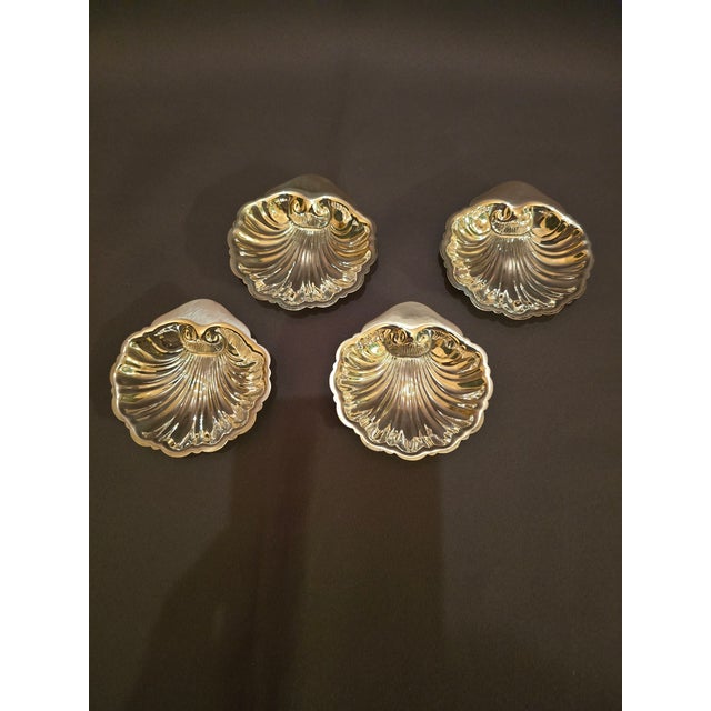 This is a set of charming shell shaped Cartier sterling dishes. These could be used at a place setting with nuts or as...
