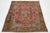 This vintage hand-knotted Persian wool rug has a light red field, medallion design, and multicolor accents. This rug...