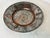 This gorgeous metal platter is gray and copper with incised designs depicting leaves and other shapes. The top surface of...