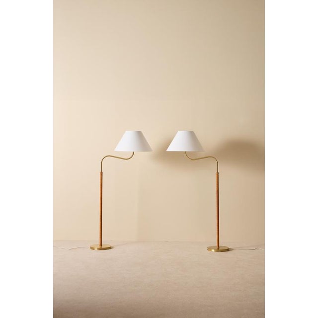 Designed by Josef Frank in 1939, this pair produced circa 1960s. New leather and new original Svenskt tenn lampshades....
